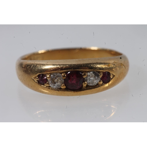 132 - Early 20thC 18ct gold ruby and diamond ring, the graduating stones in a clawed boat setting on a tap... 