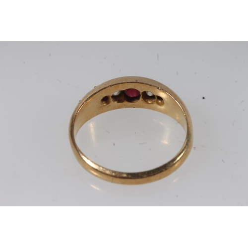 132 - Early 20thC 18ct gold ruby and diamond ring, the graduating stones in a clawed boat setting on a tap... 