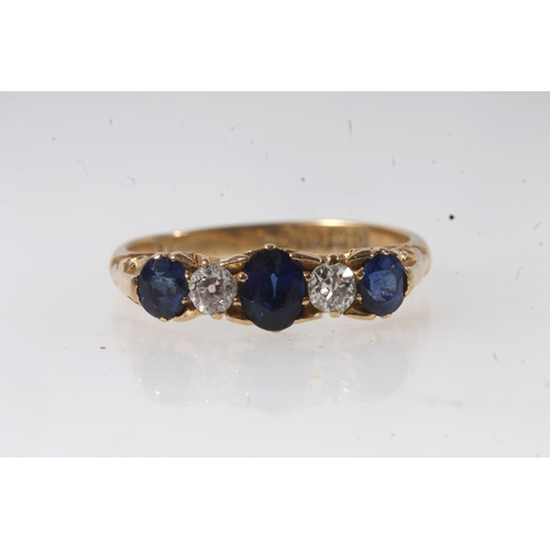 133 - c1930s 18ct gold sapphire and diamond five stone ring, the oval cut sapphires and round cut diamonds... 