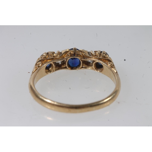 133 - c1930s 18ct gold sapphire and diamond five stone ring, the oval cut sapphires and round cut diamonds... 