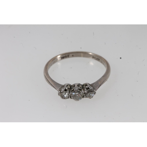 134 - c1930s 18ct gold and platinum diamond trilogy ring, the round cut diamonds prong set in a basket mou... 