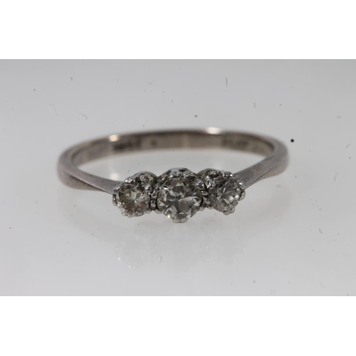 134 - c1930s 18ct gold and platinum diamond trilogy ring, the round cut diamonds prong set in a basket mou... 