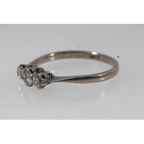 134 - c1930s 18ct gold and platinum diamond trilogy ring, the round cut diamonds prong set in a basket mou... 