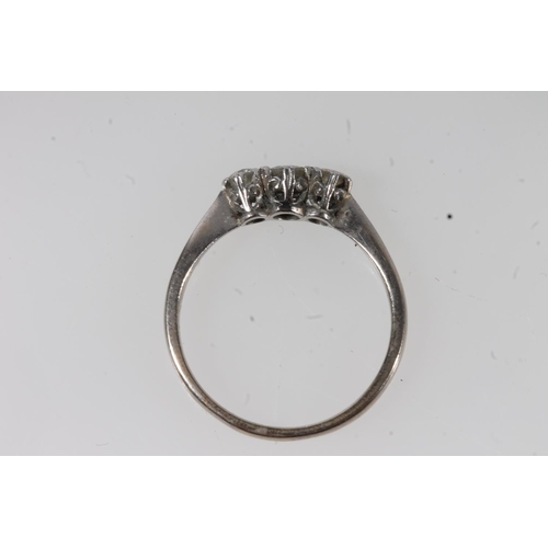 134 - c1930s 18ct gold and platinum diamond trilogy ring, the round cut diamonds prong set in a basket mou... 