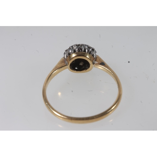 135 - 18ct gold diamond cluster ring, the principal round cut diamond bezel set within a halo of prong set... 