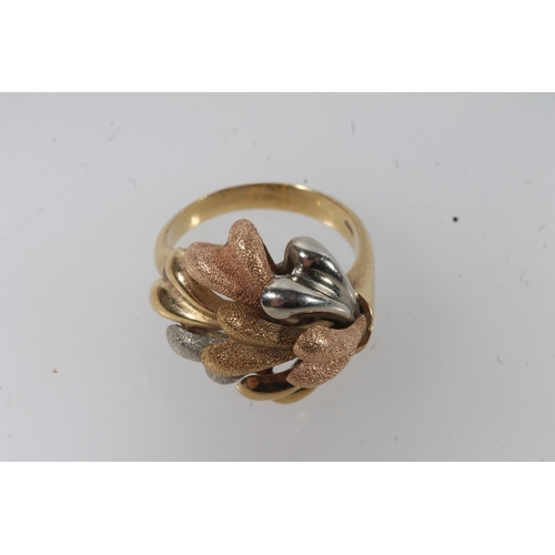 136 - 18ct gold modernist ring, the textured polychrome gold sprays on a plain tapering band, size P, 8.4g... 