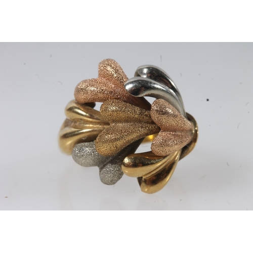 136 - 18ct gold modernist ring, the textured polychrome gold sprays on a plain tapering band, size P, 8.4g... 