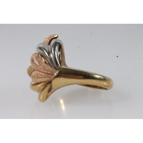 136 - 18ct gold modernist ring, the textured polychrome gold sprays on a plain tapering band, size P, 8.4g... 