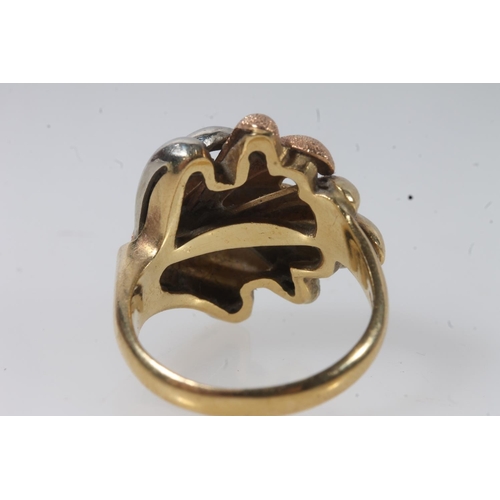 136 - 18ct gold modernist ring, the textured polychrome gold sprays on a plain tapering band, size P, 8.4g... 