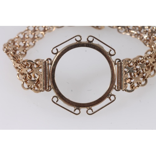 154 - 9ct gold bracelet with sovereign frame, 11.5g.