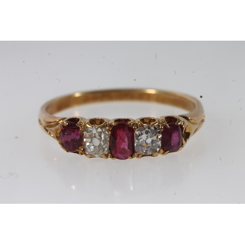 176 - 18ct gold ruby and diamond ring, the three oval cut diamonds separated by round cut diamonds, on scr... 