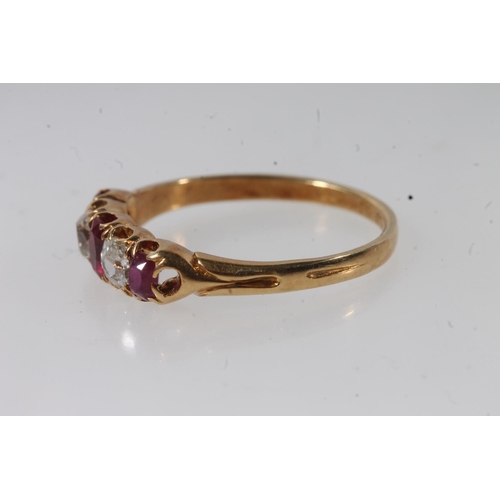 176 - 18ct gold ruby and diamond ring, the three oval cut diamonds separated by round cut diamonds, on scr... 