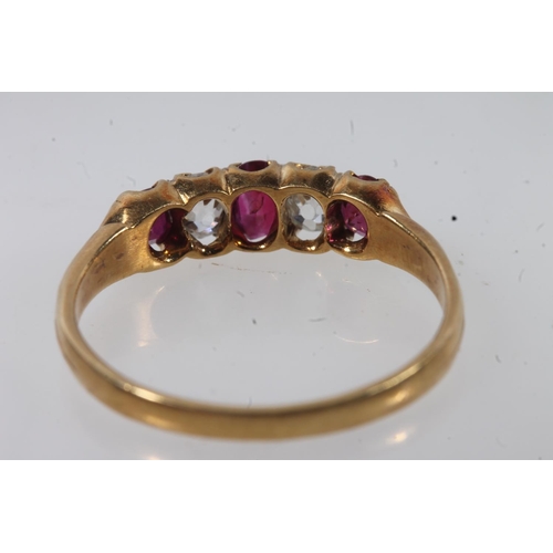 176 - 18ct gold ruby and diamond ring, the three oval cut diamonds separated by round cut diamonds, on scr... 