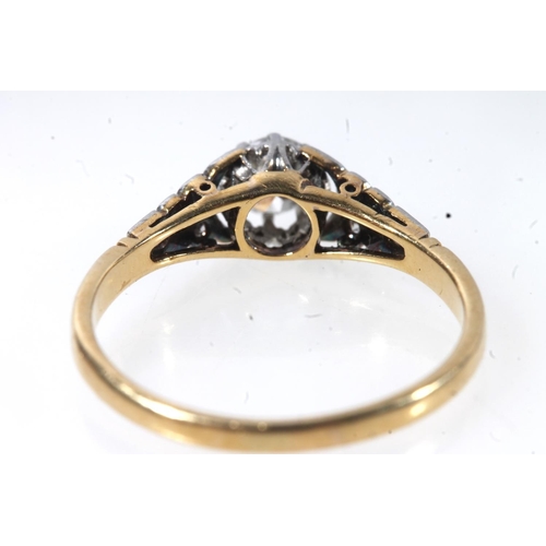 177 - 18ct gold and platinum solitaire diamond ring, the round cut brilliant in a claw setting, flanked by... 