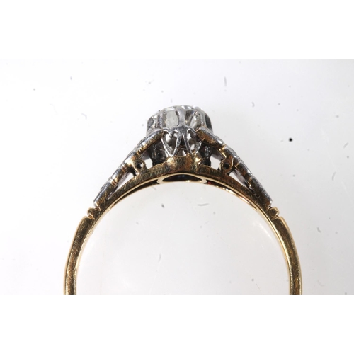 177 - 18ct gold and platinum solitaire diamond ring, the round cut brilliant in a claw setting, flanked by... 