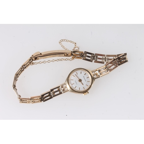 191 - Ladies 9ct gold Accurist wristwatch with baton five minute markers, on 9ct gold gate link strap, gro... 