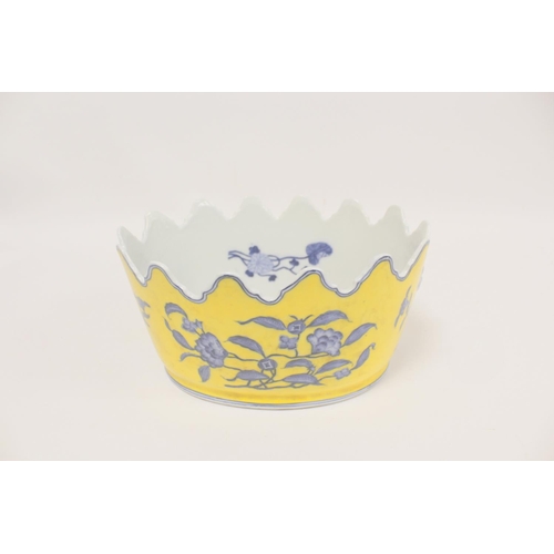 335 - Chinese style Monteith bowl on a yellow ground with blue foliage, and faux lion mask handles to each... 