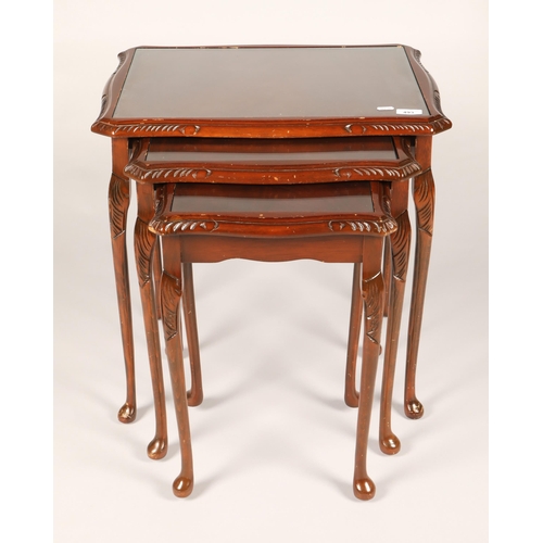 493 - Nesting set of three glass topped mahogany side tables