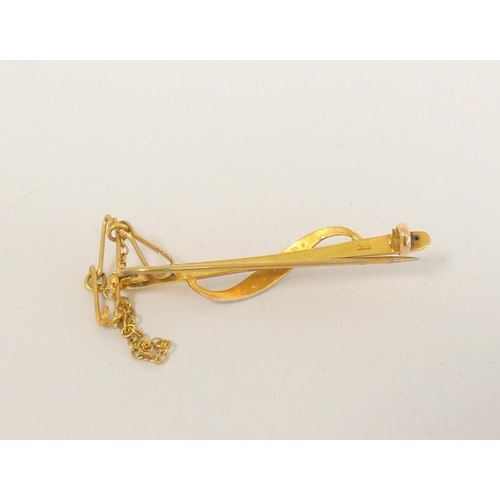 100A - Stick pin set with a seed pearl, head marked 9ct, another yellow metal set with a diamond and four p... 