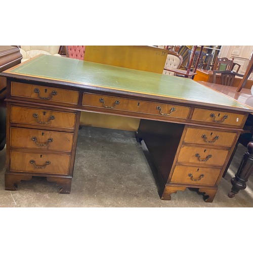 597 - Leather topped mahogany desk, (L) 153cms x (W) 62cms, 77 (H)