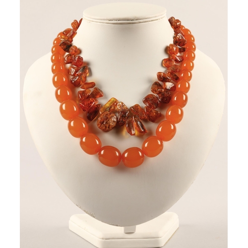 106A - Raw amber bead necklace and an amber colour bakelite/plastic necklace