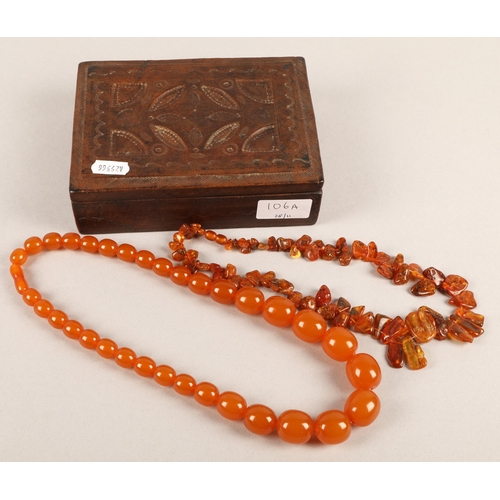 106A - Raw amber bead necklace and an amber colour bakelite/plastic necklace