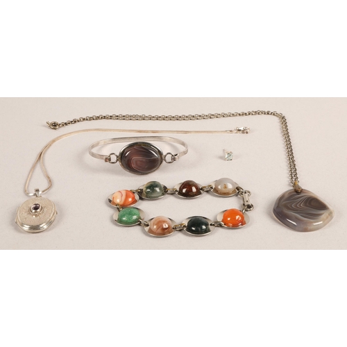 110A - Silver and white metal jewellery to include a purple gem set locket on silver chain, a gem set bangl... 