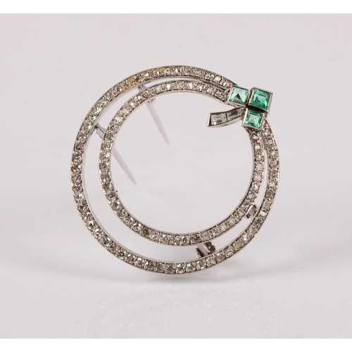 55A - Art Deco style circular white metal brooch set with diamonds and a trio emeralds in a clover design,...