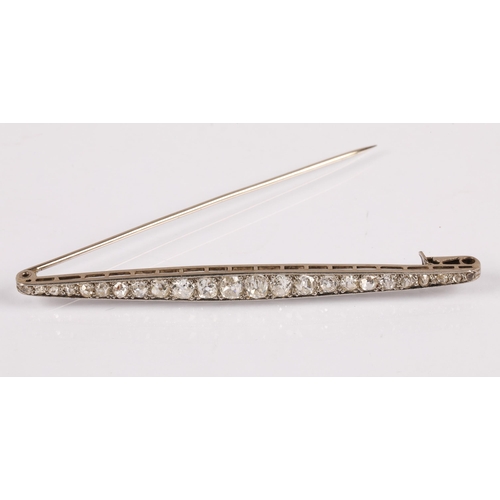 57A - White metal bar brooch set with a graduated  old cut diamonds, 8cm, 7.4g