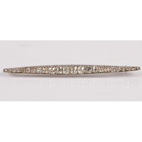 57A - White metal bar brooch set with a graduated  old cut diamonds, 8cm, 7.4g