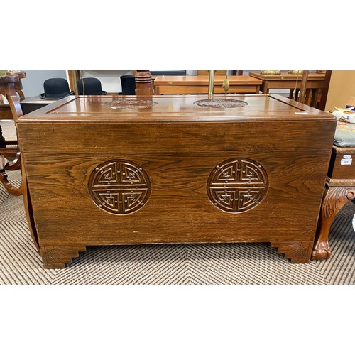 568 - Oriental mahogany coffer with carved detail