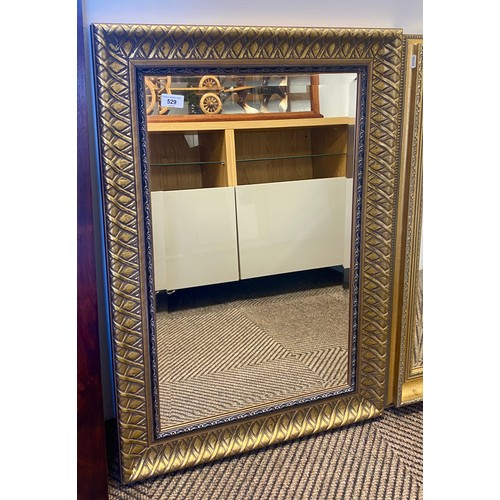 529 - Ornately framed contemporary wall mirror