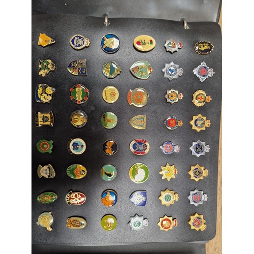 347 - Two folders of vintage pin badges to include extensive collection of police force, Metropolitan poli... 