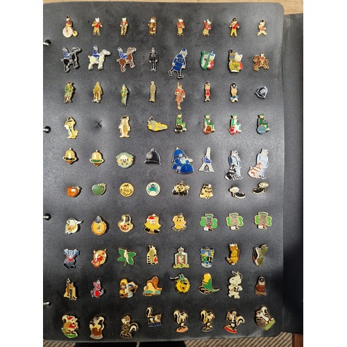 347 - Two folders of vintage pin badges to include extensive collection of police force, Metropolitan poli... 