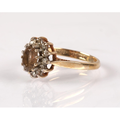 117 - 9ct gold ring set with a smoky quartz stone surrounded by white stones, 2.6g, ring size O