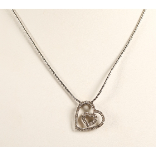 148 - 9ct white gold chain with a white metal heart-shaped pendant set with diamonds, gross weight 4.9g