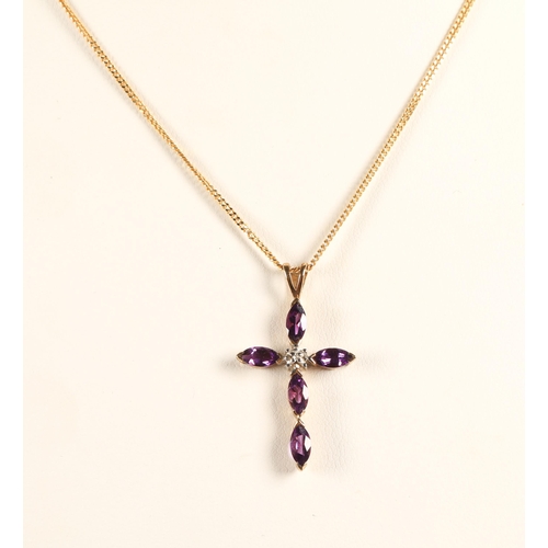 153 - 9ct gold crucifix pendant necklace set with purple gems and a diamond, 3.5g