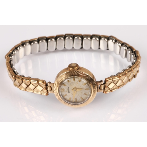 84 - Ladies 9ct gold cased Helvetia wristwatch on plated expanding bracelet, 12g gross.