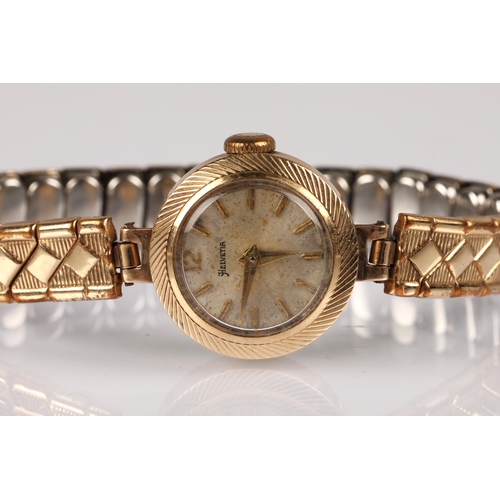 84 - Ladies 9ct gold cased Helvetia wristwatch on plated expanding bracelet, 12g gross.