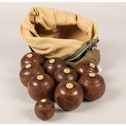 252 - Set of eight wooden carpet bowls with bone inlay 