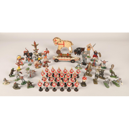 256 - Large quantity of assorted metal toy soldiers, guardsman, cowboys and indians, buffalo, some mounted... 