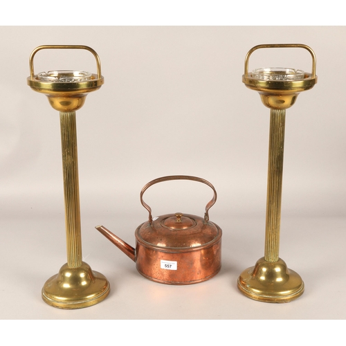 557 - Pair brass smoking stands 54cm h to tip of handle, with a copper kettle