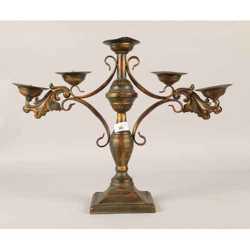 561 - Resin decorative pate with a pillar candle candelabra