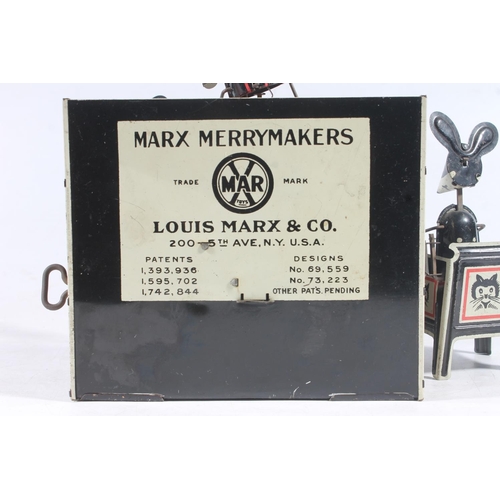 1408 - Louis Marx & Co of the USA, a Marx Merrymakers tinplate clockwork mouse band with conductor, pia... 