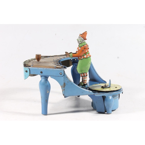 1407 - Vintage zilotone tinplate clockwork model of a clown playing xylophone with Silent Night disc, proba... 