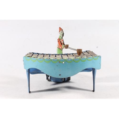 1407 - Vintage zilotone tinplate clockwork model of a clown playing xylophone with Silent Night disc, proba... 