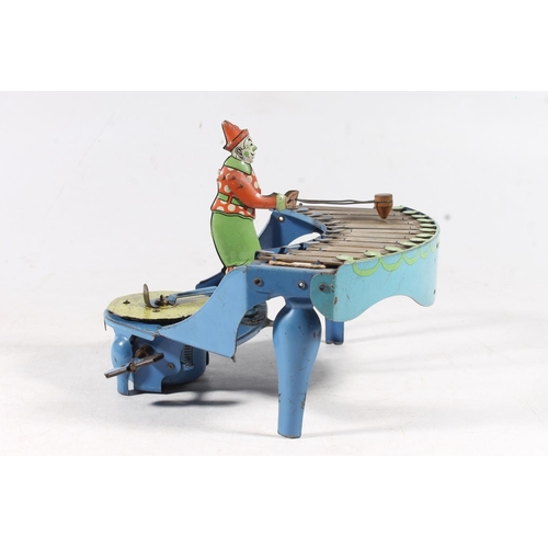 1407 - Vintage zilotone tinplate clockwork model of a clown playing xylophone with Silent Night disc, proba... 