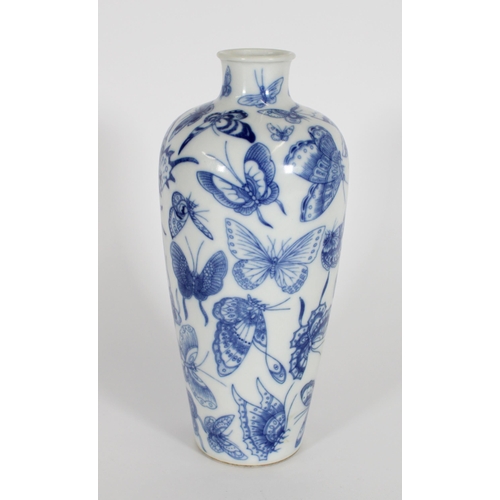 346 - Chinese blue and white baluster vase, the body decorated in underglaze blue with butterflies, four c... 