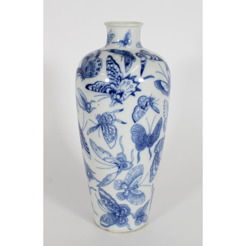 346 - Chinese blue and white baluster vase, the body decorated in underglaze blue with butterflies, four c... 