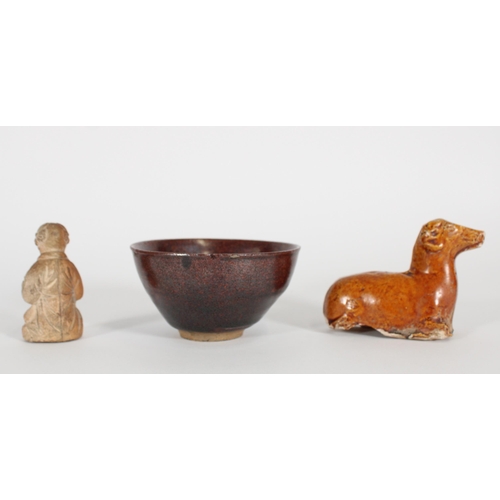 352 - Chinese glazed pottery ram, high fired glazed bowl and a terracotta figurine of a boy holding a bird... 